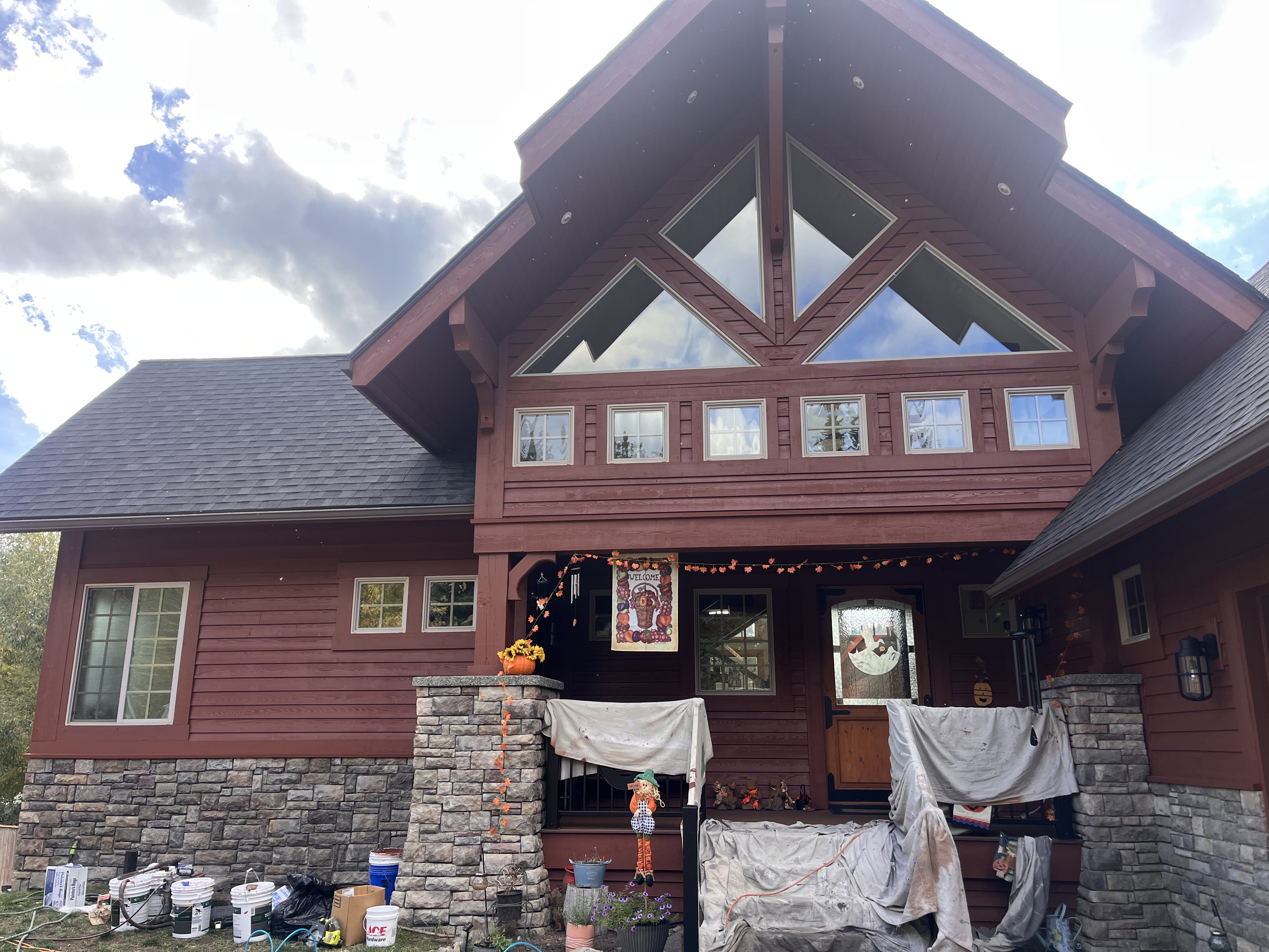 Log home front with stone columns